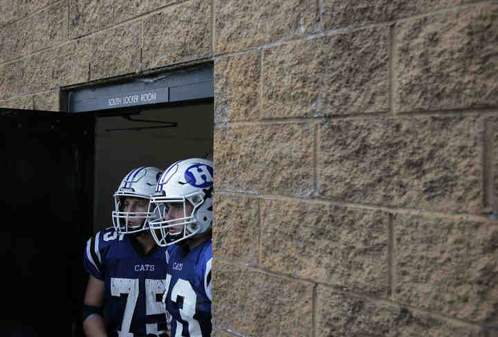 Hilliard Davidson Wildcat lineman Chase Miles (75) and Cal Ryan (73) prepare to take the field before an OHSAA high school football game between the Hilliard Davidson Wildcats and the Hilliard Bradley Jaguars on Friday, September 7, 2018 at Hilliard Davidson High School in Hilliard, Ohio.   (Joshua A. Bickel / The Columbus Dispatch)